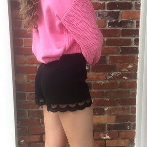 Black pants with lace appliqué